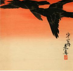 Crows flying at sunrise