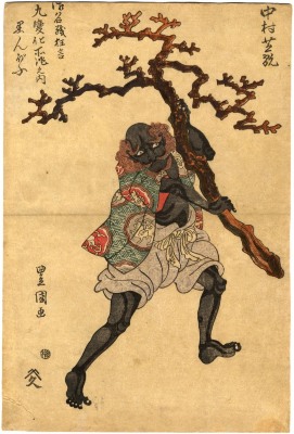 Nakamura Shikan I (中村芝翫) as a black man or <i>kuronbō</i> (黒んば) carrying a large piece of coral
